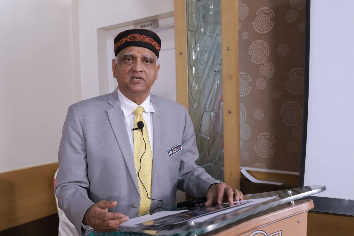 Acharya Hari Sharma addressing an astrology conference from the podium